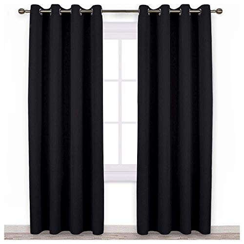 Blackout curtains for bedroom with thermal insulation and grommets featured.