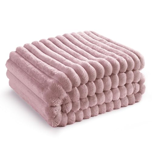 Snuggle Up in Style: Cozy Pink Fleece Blanket for Comfort.