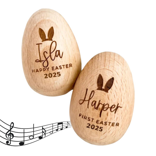 Vibrant Personalized Wooden Easter Eggs for Baby's Joyful Musical Celebration.