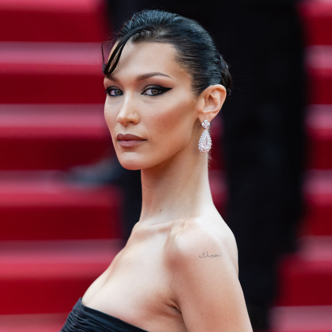 Bella Hadid Goes Nearly Naked To Tease Her New Beauty Brand's Launch